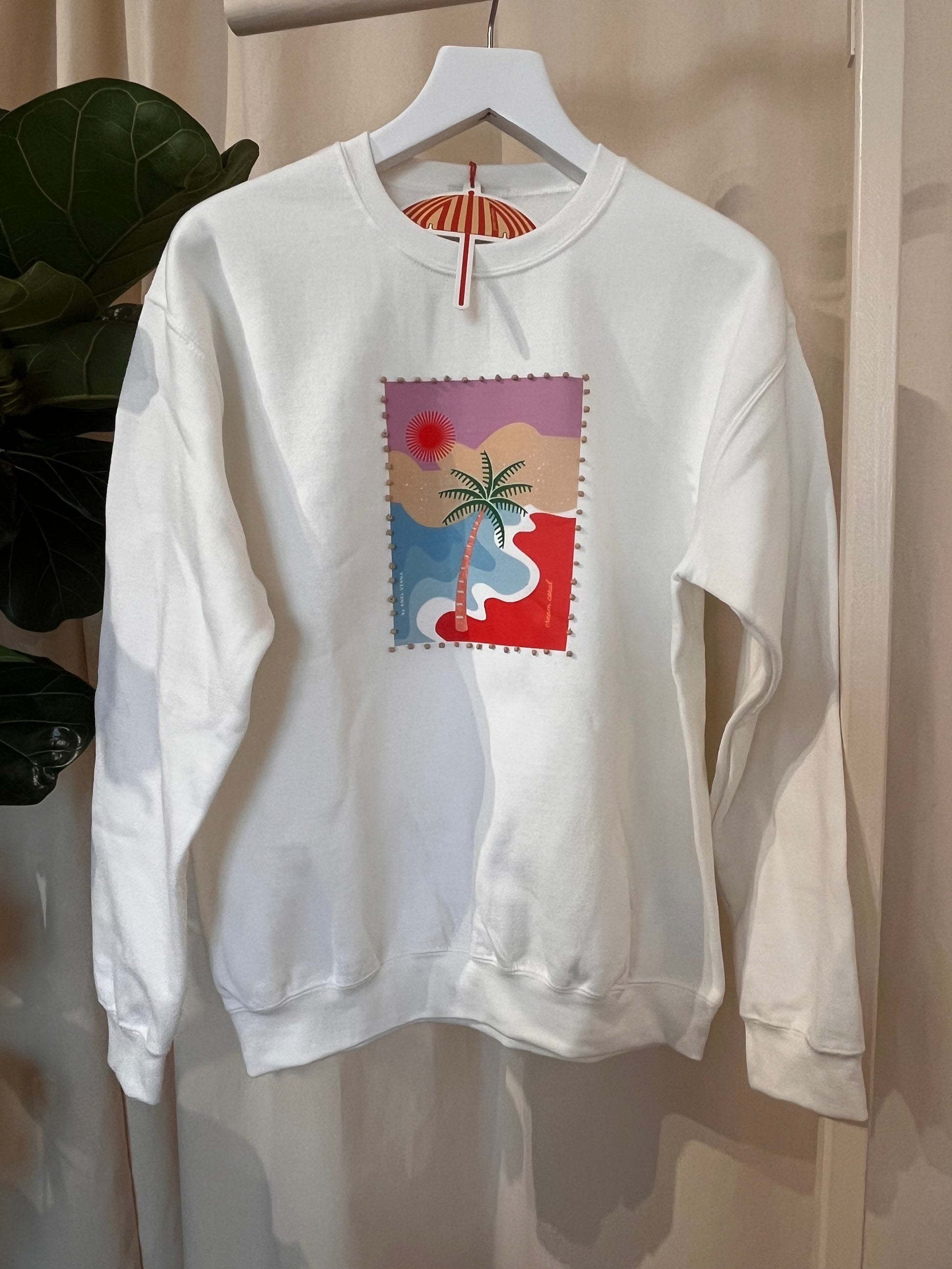 White t-shirt with a colorful graphic design on a white background