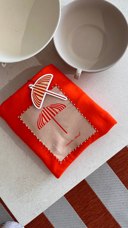sweatshirt folded on top of table